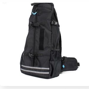 Frenchie Shop carrying backpack and goggles!